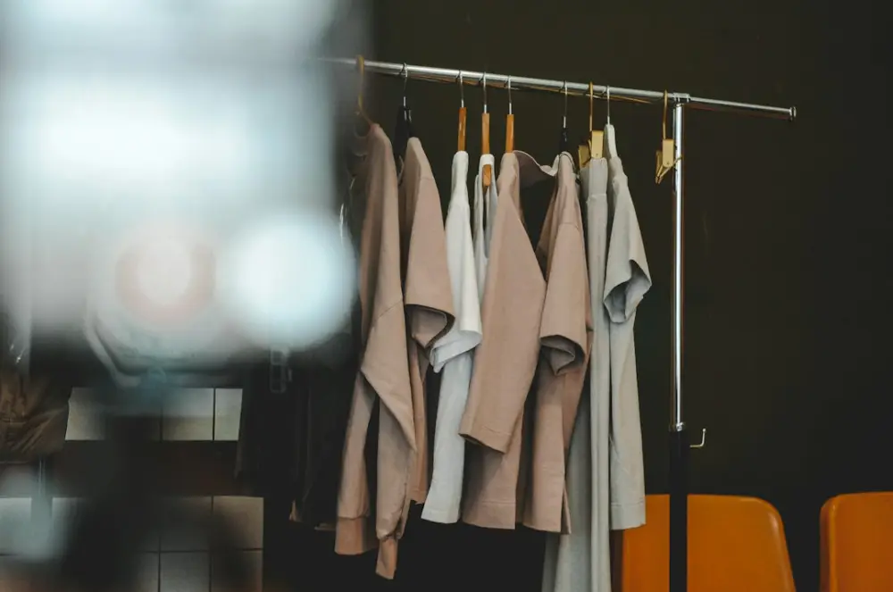 Clothes hang on a rack in a minimalist style